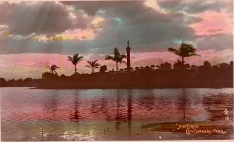 A picture of a lake with trees and clouds